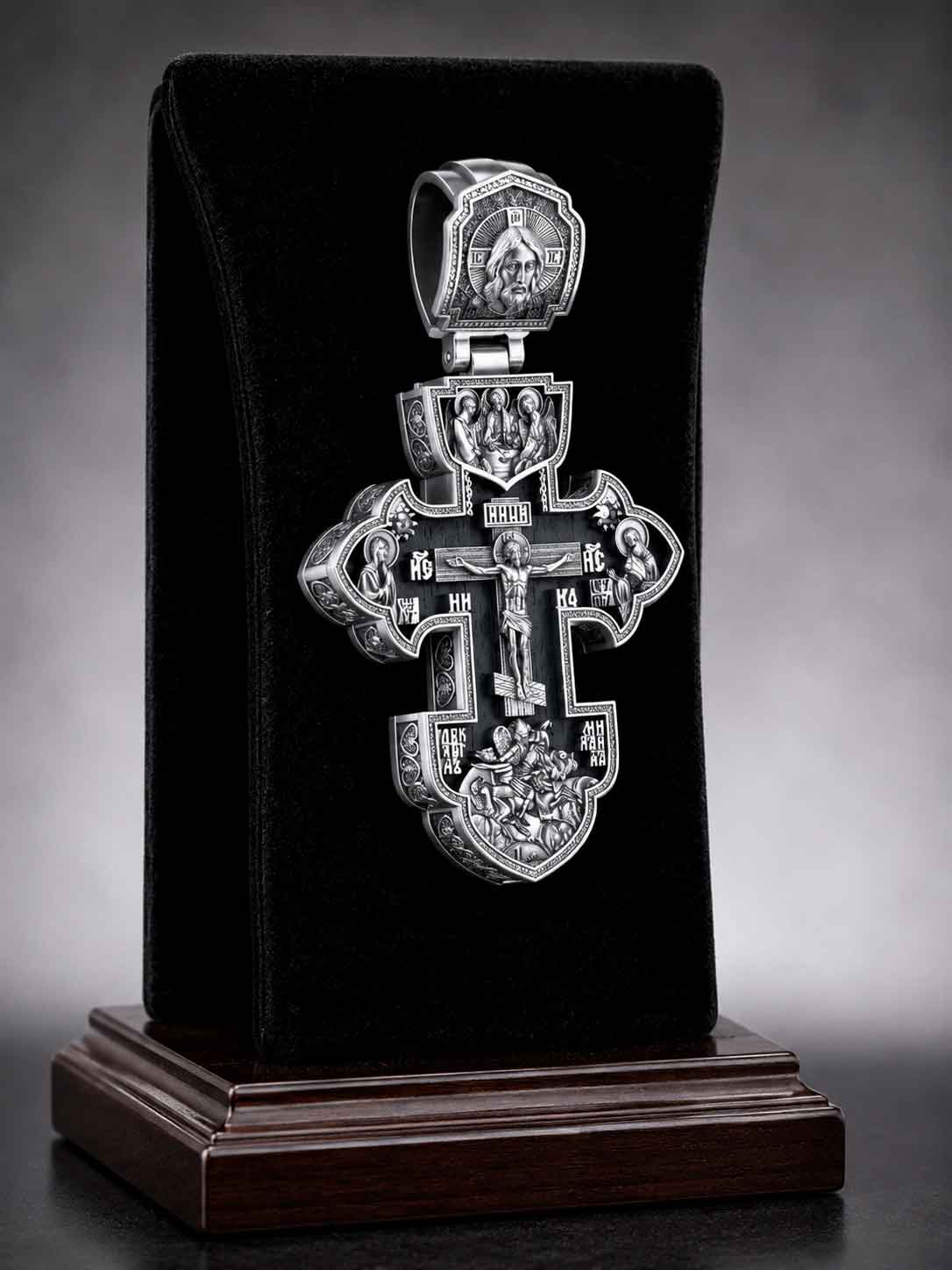 Silver Orthodox Cross "Saints, Protectors and Defenders" (Art. 650400) Silver Orthodox cross pendant with ebony wood, featuring Jesus Christ, the Holy Trinity, and St. George