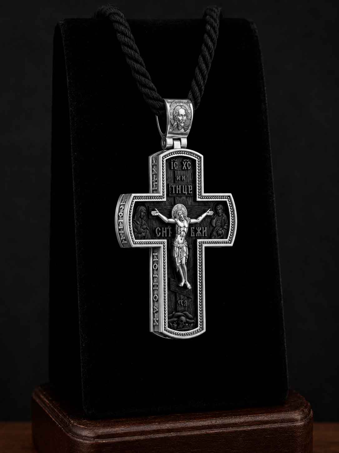 Silver Orthodox Cross "Sobor of Holy Protectors" (Art. 650360) Silver Orthodox cross pendant with ebony wood insert featuring St. Nicholas, St. George, and a crucifix